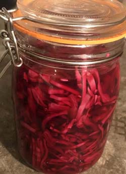 a Kilner jar of pickled a red cabbage